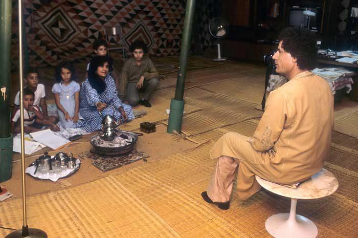 Mu'ammar teaching his family