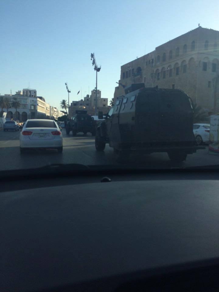 Armored vehicles patrol Green Square, 1